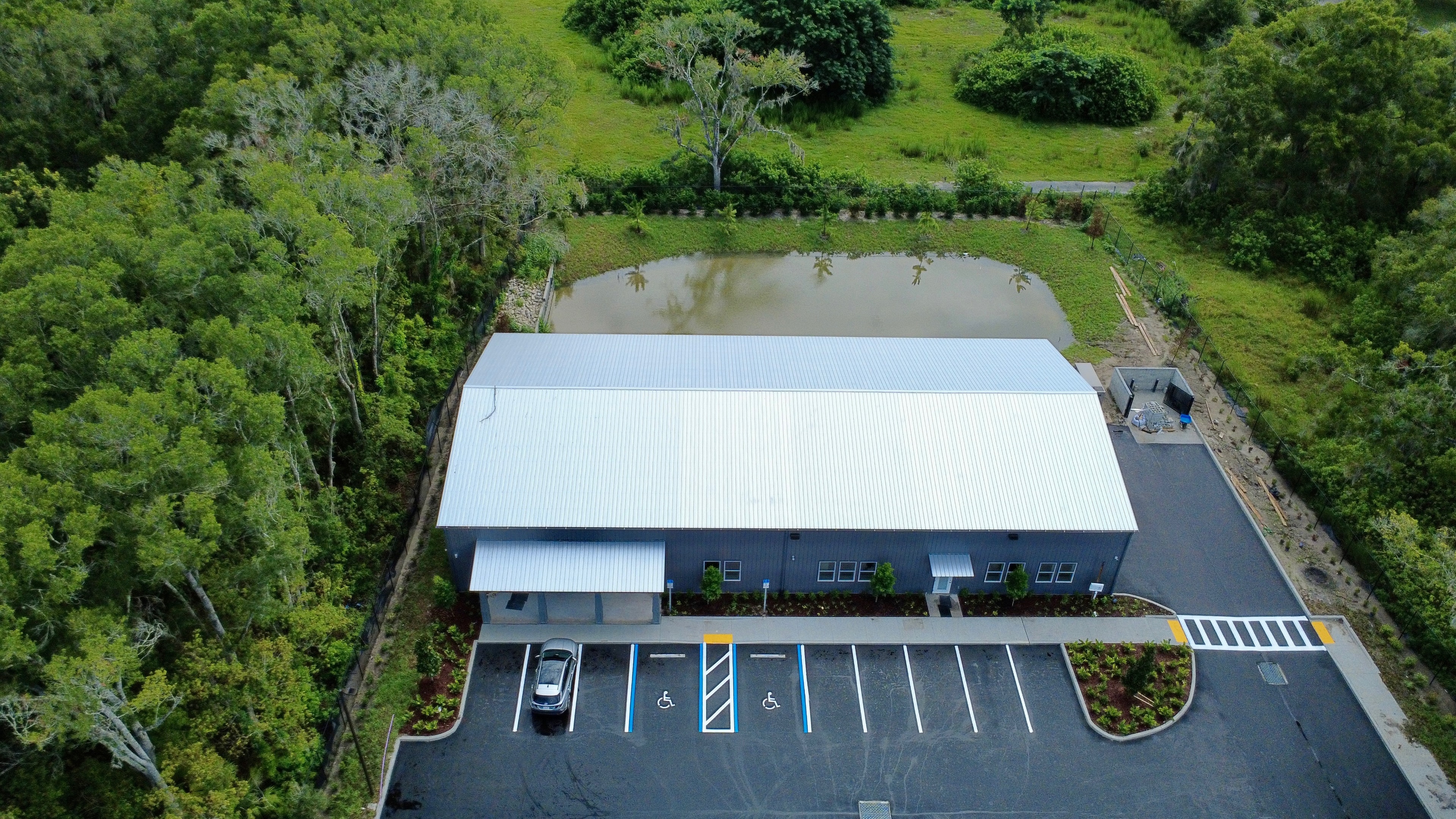 Aerial view of completed commercial building and parking lot